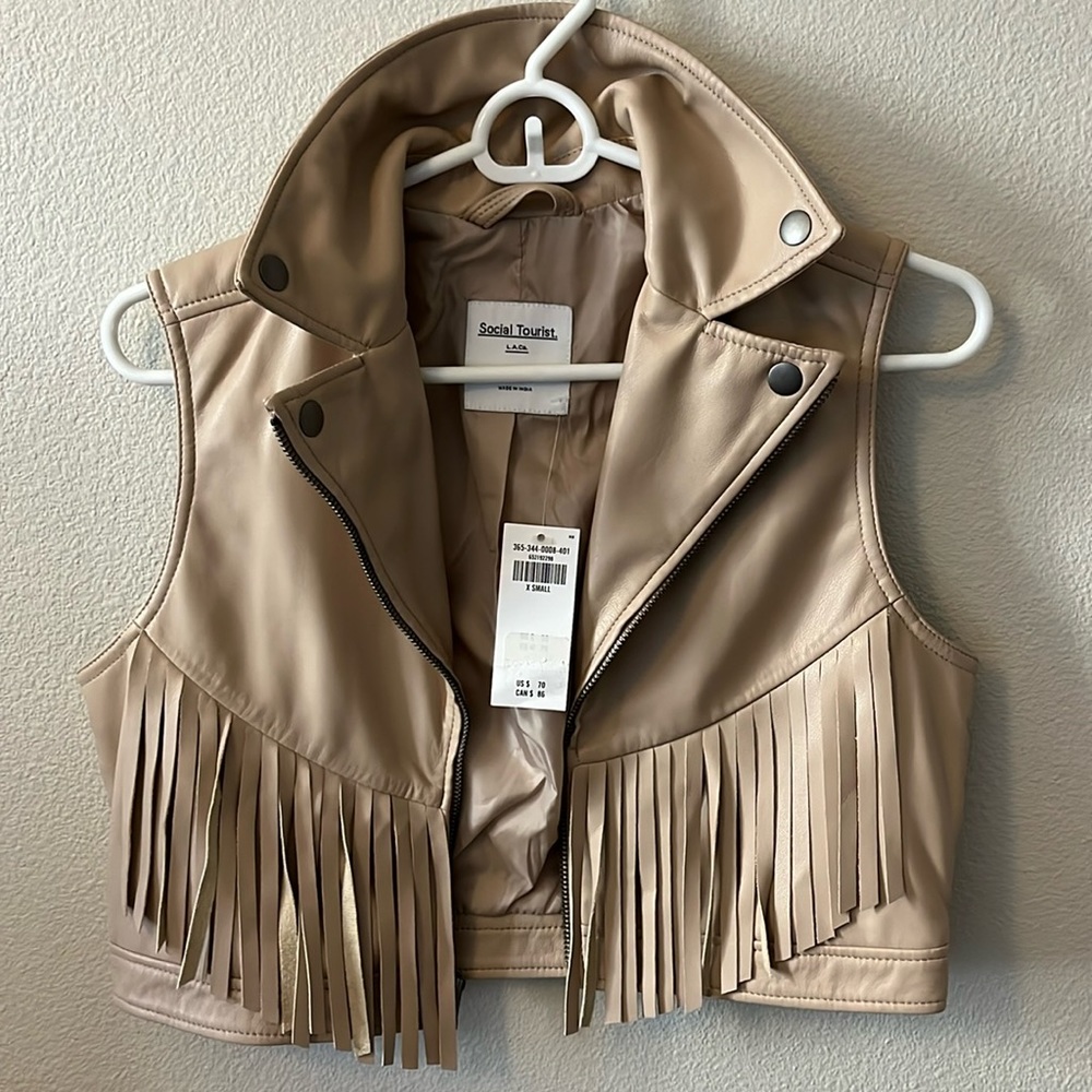 Leather vest with tags